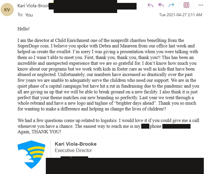 Child Enrichment's director thanks Adam Howell for the SuperDoge donation